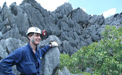 Dr Jonathan Cramb emerging from the cave where Leggadina irvini was discovered